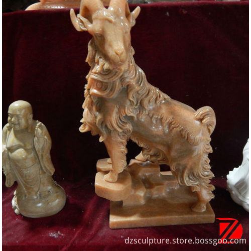 small stone goat sculpture